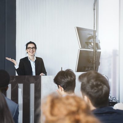 Business woman giving presentation at conference room